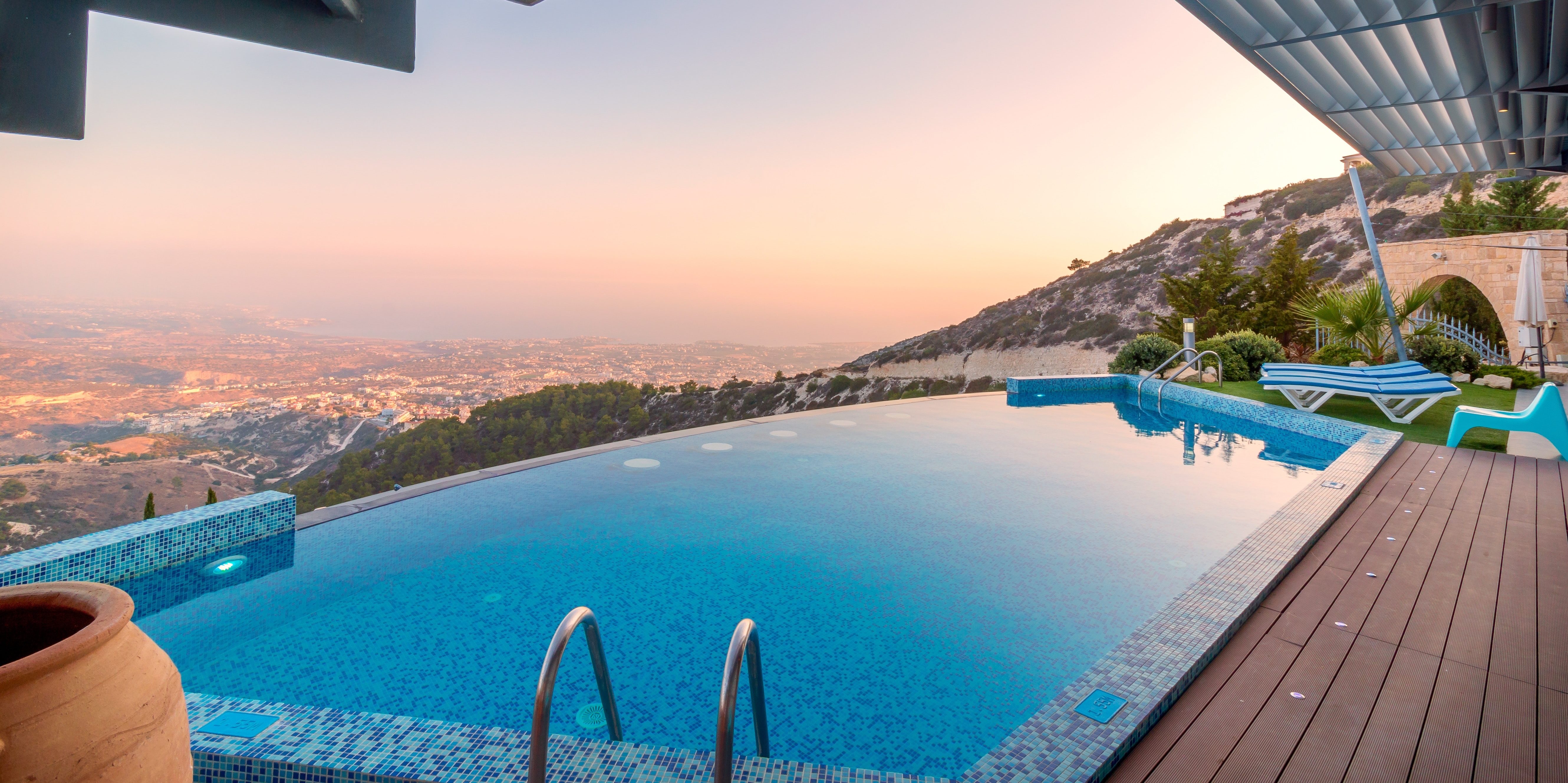 A scenic view from an infinity pool on a mountain property
