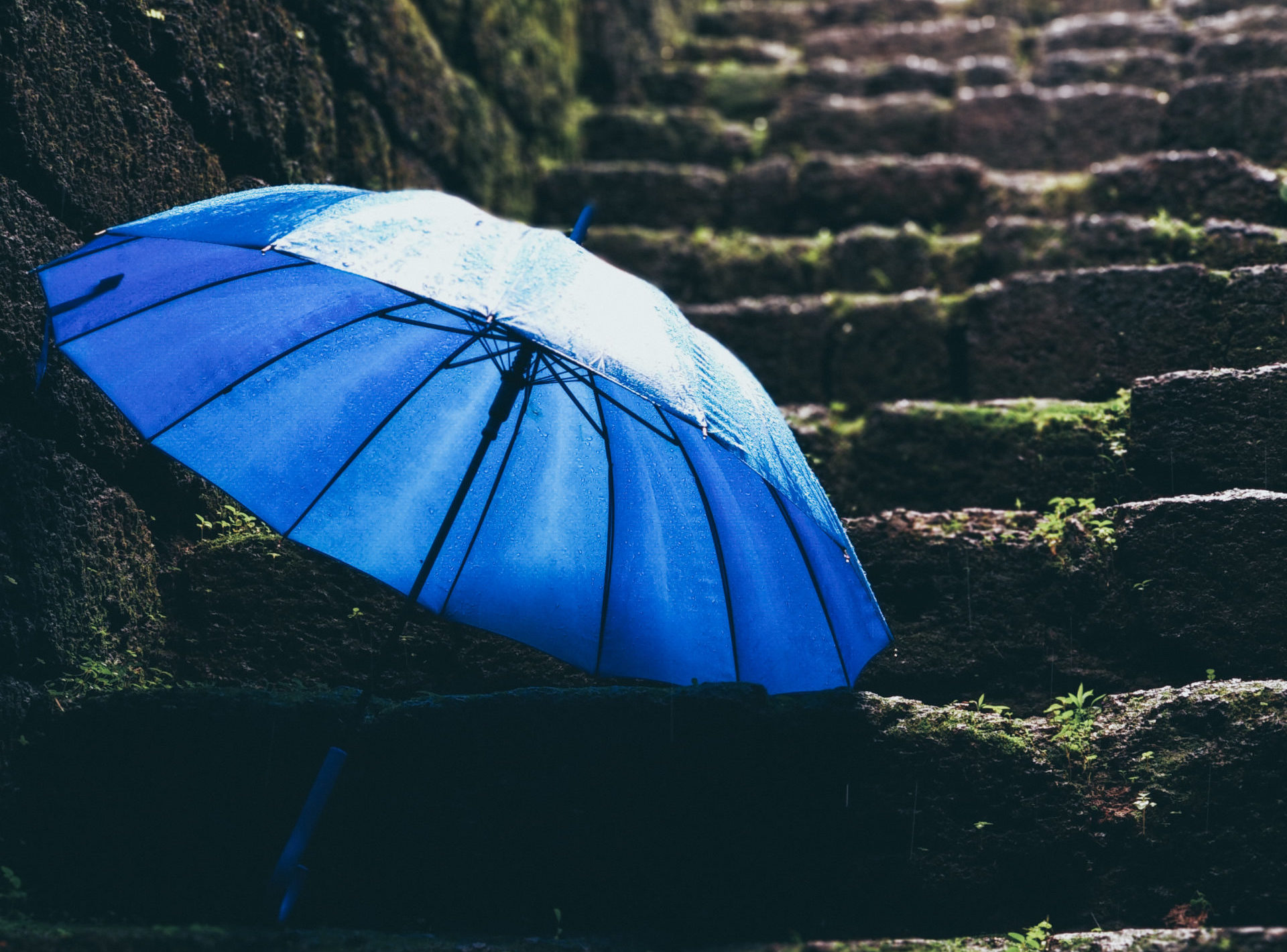 An umbrella on a stone stairs
