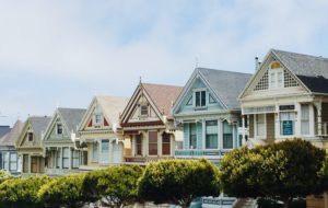 A row of colorful Victorian homes