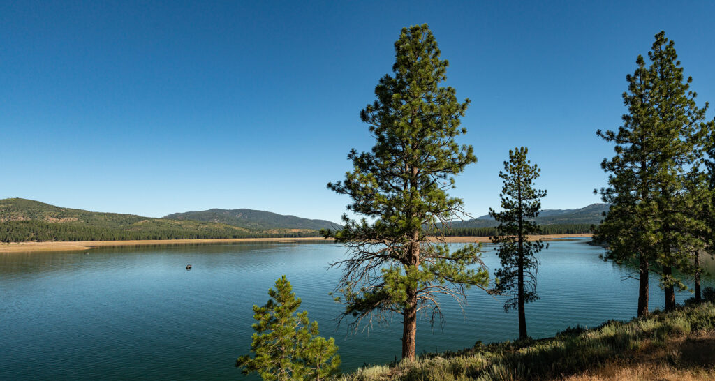 A reservoir in the Sierra Nevada mountains, represents a mild 2023 California fire season.